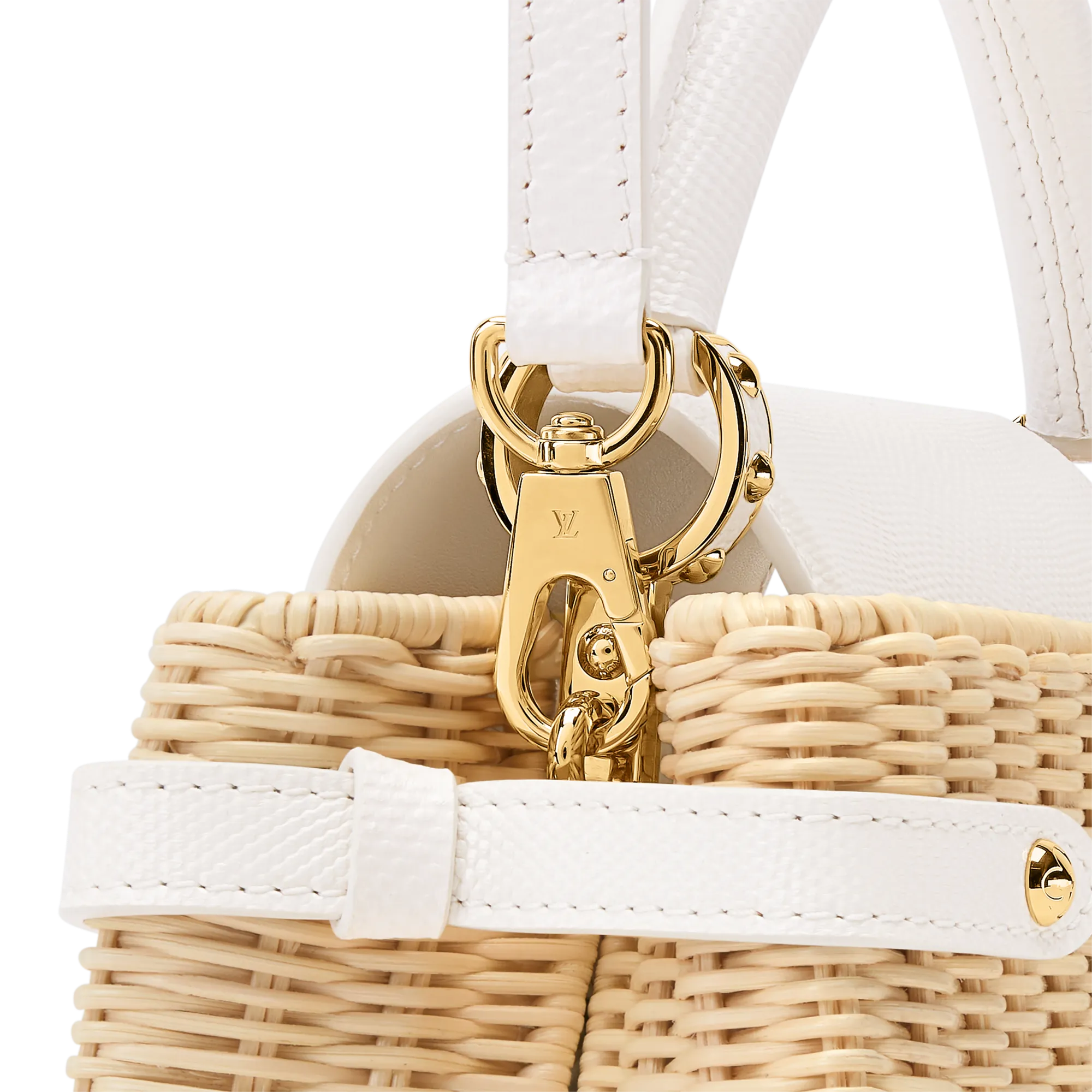 Close-up of a white leather handbag with gold hardware and woven basket texture showing a LV-branded clasp.